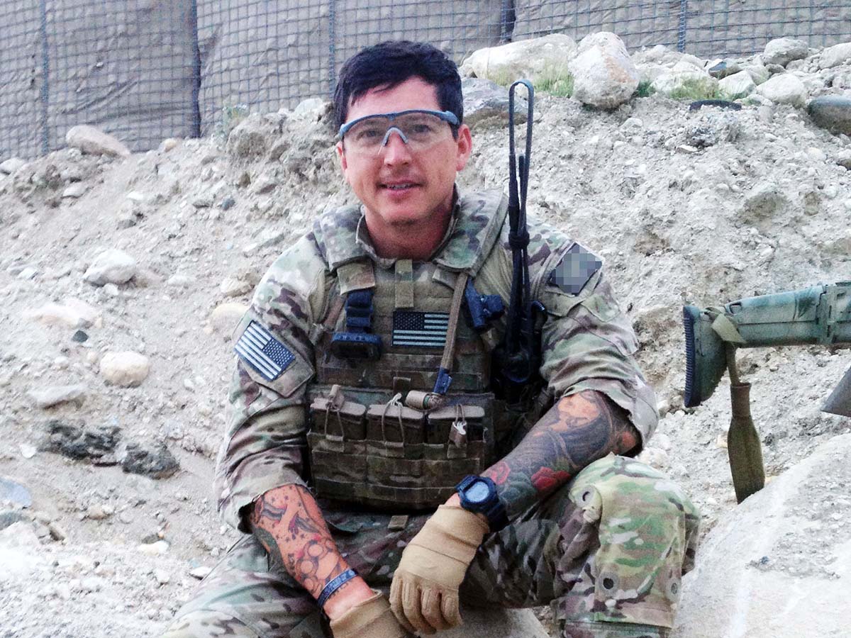 Veteran in military attire during active duty in the field prior to beginning his MBA