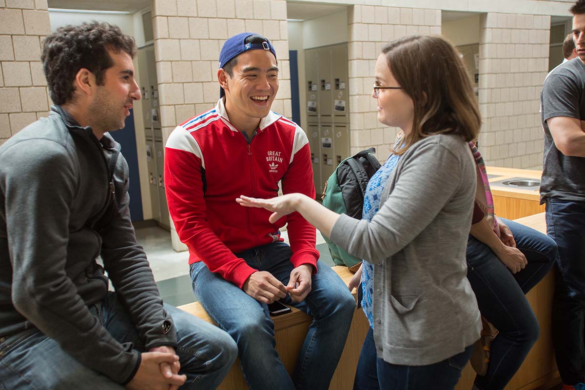 Students chat in Fuqua's mallway between classes